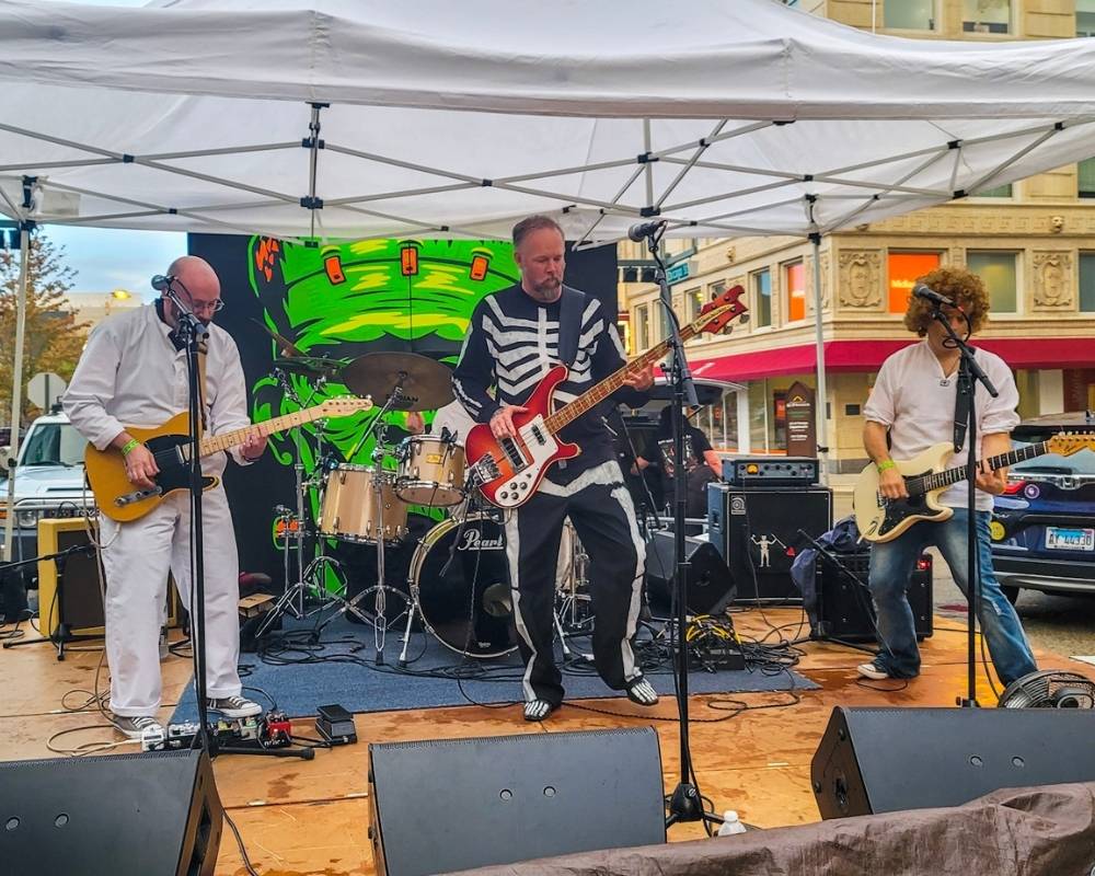 Band playing under a tent