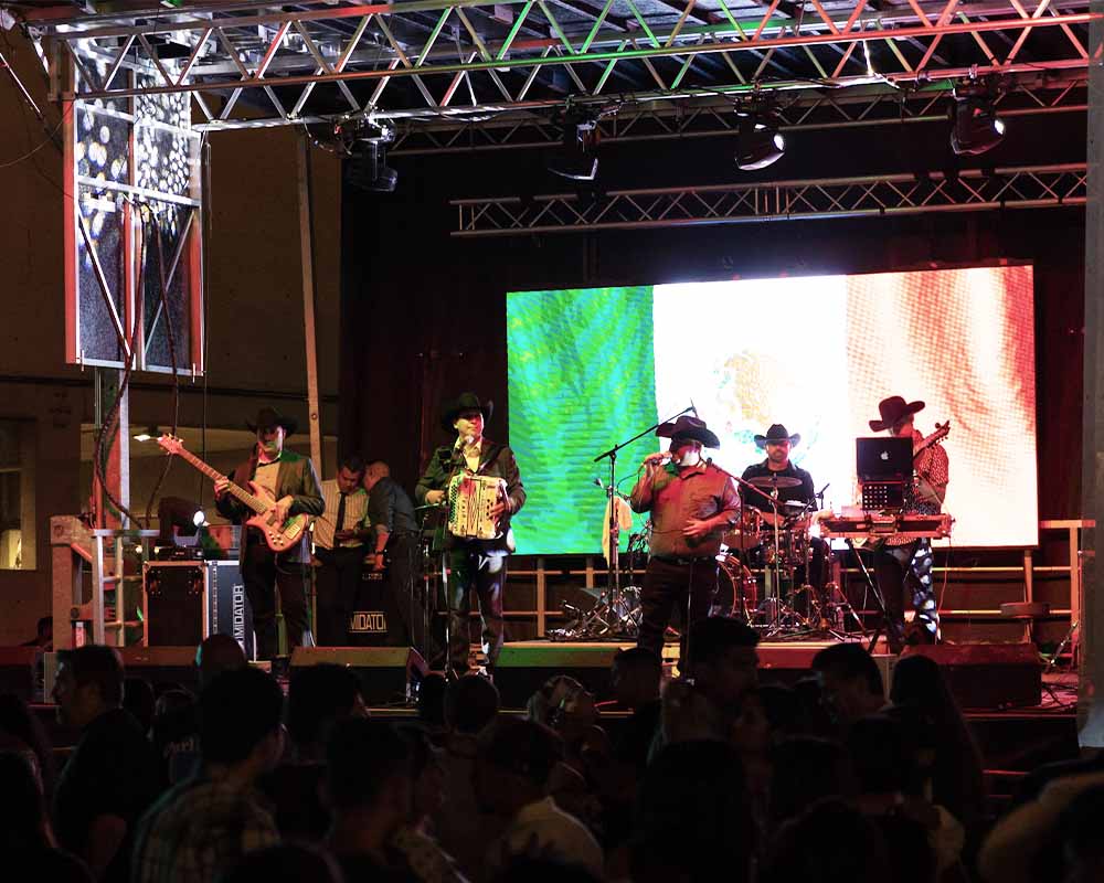 Band playing on a large stage outside