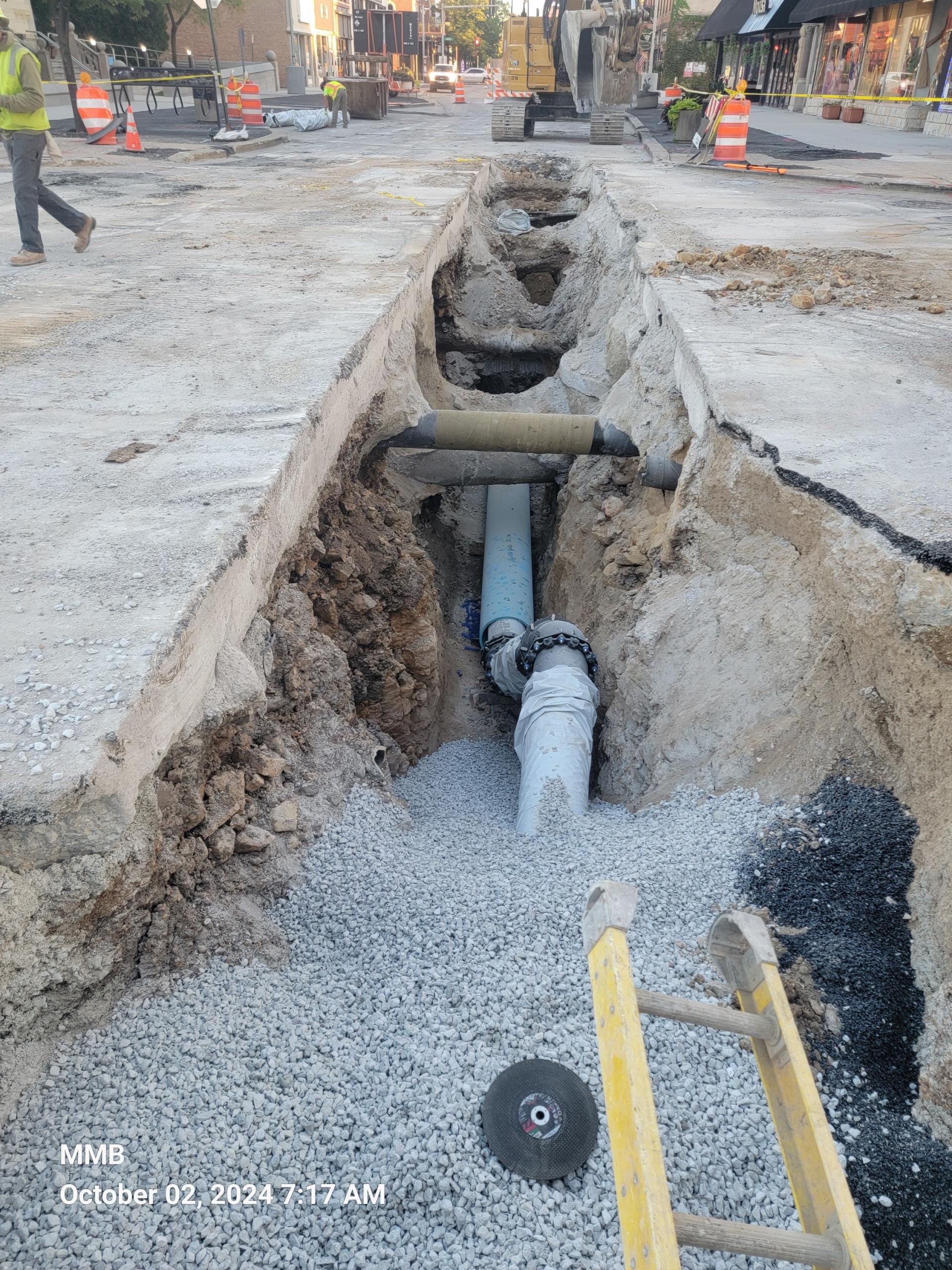 Water main installation below existing utilities on Clinton Street